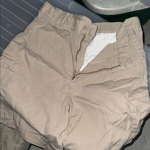 Men's Tan Cargo Shorts with large Velcro pockets on sides then 2 flat pkt rear